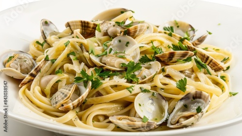 Culinary still life of seafood linguine with clams in light sauce and herbs, isolated photo