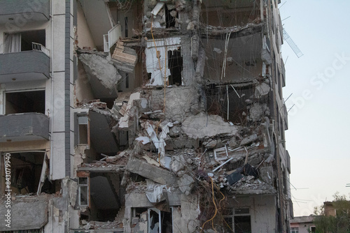 Bild auf Leinwand A building in Turkey damaged and collapsed as a result of an earthquake