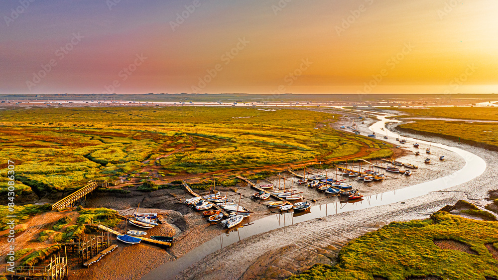 Fototapeta premium Morston Quay, bathed in a sunrise glow
