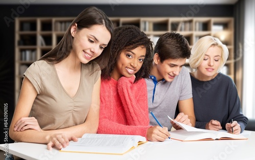 Young college friends student study together