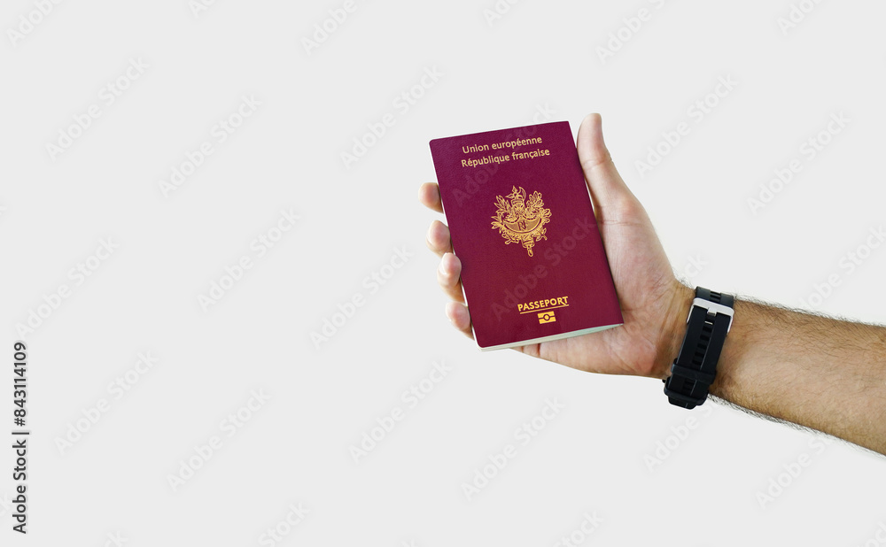 Man holding France Passport in hand on white background with copy space - French Man holding France Passport in hand on white background with copy space - French