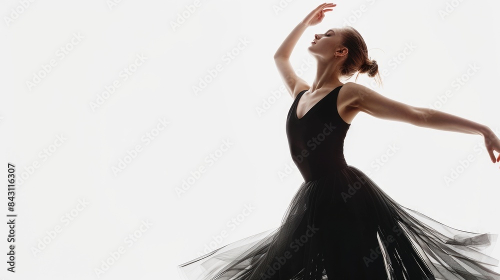A woman in a black dress dancing to music A woman in a black dress dancing to music