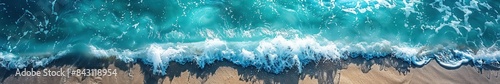 Ocean waves meeting the sandy shore, viewed from above. Banner, panorama