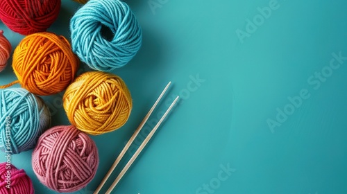  Blue background with knitting needles and yarn balls