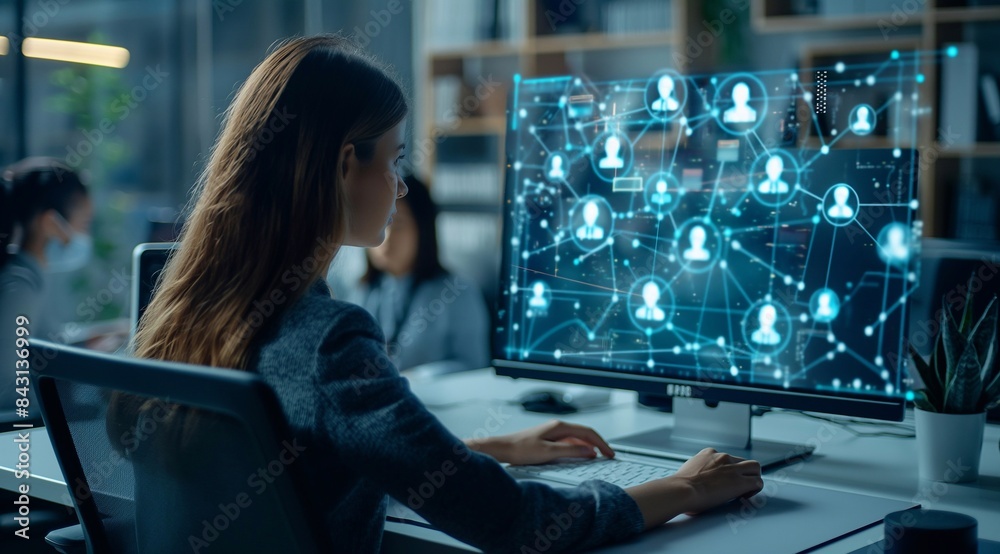 Futuristic digital screen showing a virtual business network with people icons. A woman is using a computer in the style of a social media concept for human resources or human care. generative AI