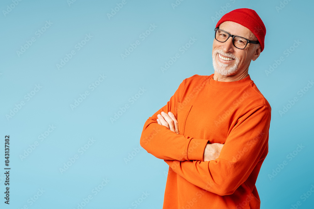 Portrait of grey haired smiling senior man with arms crossed posing isolated Portrait of grey haired smiling senior man with arms crossed posing isolated