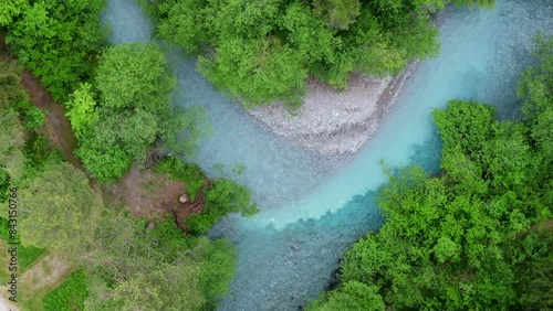 Drone view of the small river with turquoise water near Flims in Canton Graubunden in Switzerland. photo