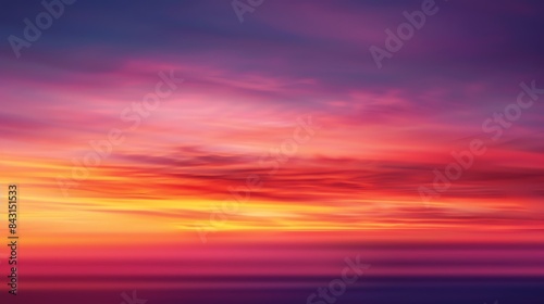 A vivid sunset sky with vibrant oranges  pinks  and purples.