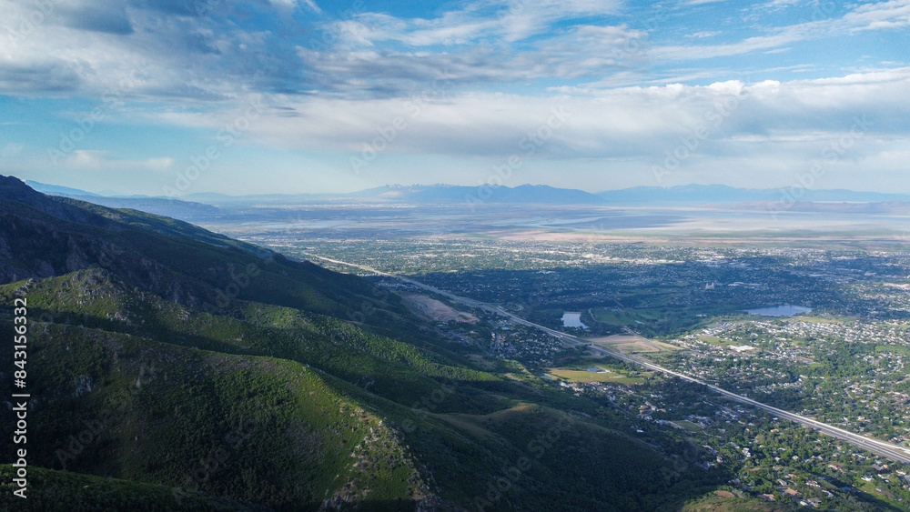 Fototapeta premium Aerial Views of Richmond Utah Canyon Mountain Range and Cache Valley Area with Incoming Storm Clouds