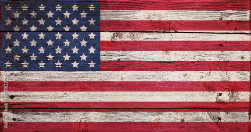 USA flag painted on old wooden background Effect of cracked aged flaky paint Grunge style 4th july Independence day of America Fourth of july Copy space Stars and strips Red blue white colors 