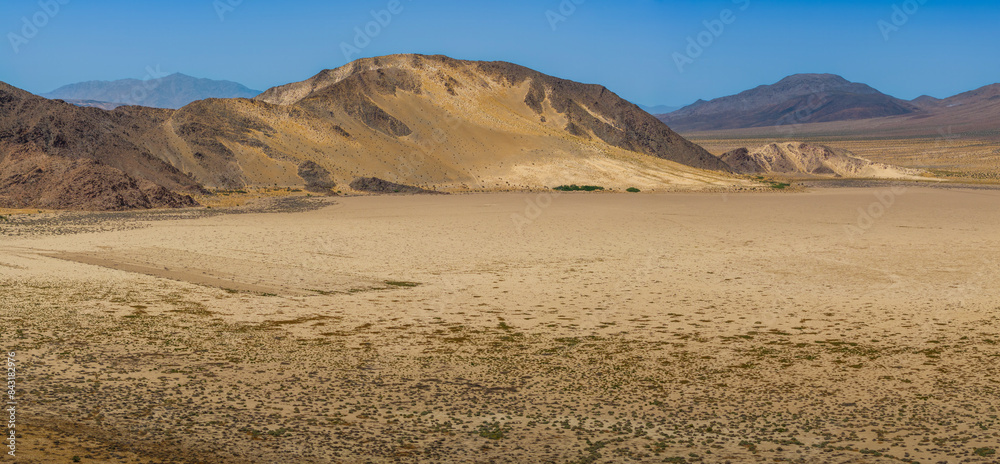 Aerial panoramic view of mountains, Mohave desert and sand drifts against hillsides in the Cronese Valley Aerial panoramic view of mountains, Mohave desert and sand drifts against hillsides in the Cronese Valley
