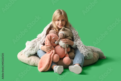 Cute little girl with plush...