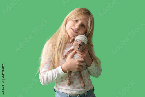 Cute little girl with plush...