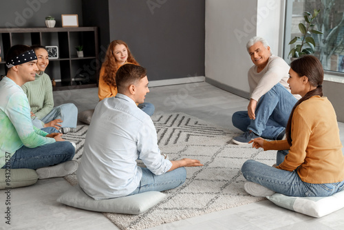 People sitting on pillows a...