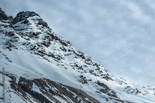 Obraz na płótnie A freezing day high in the Andes Mountains in Chile, with mountains covered in snow. w salonie