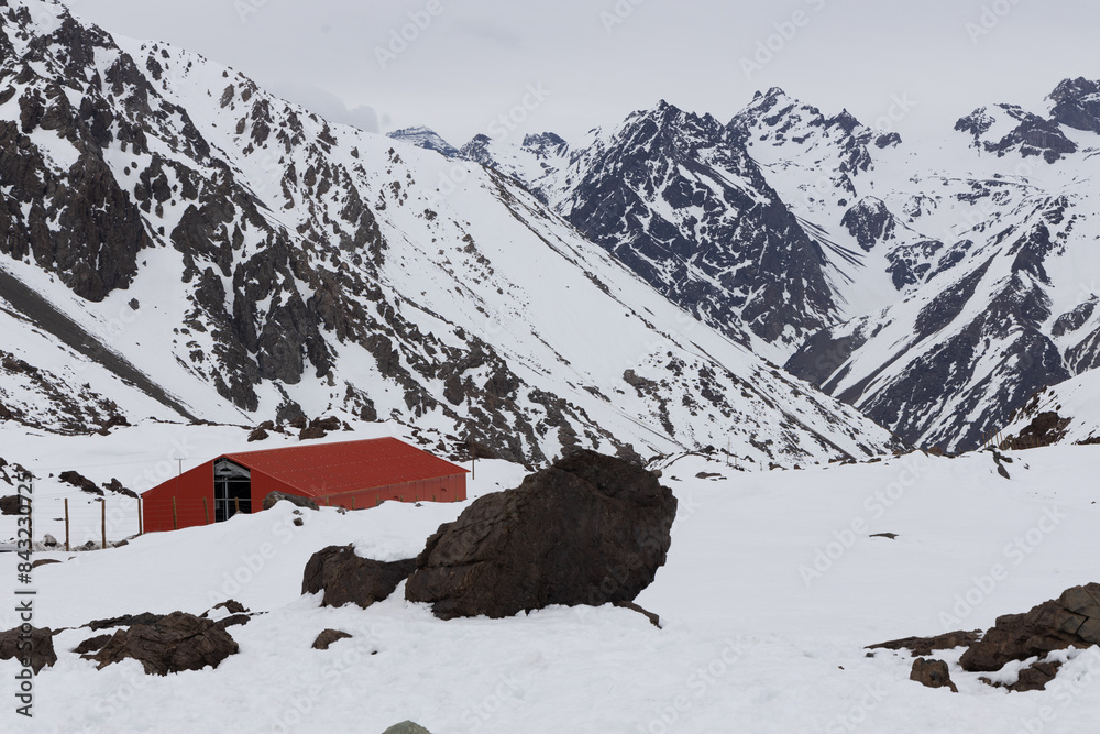 A freezing day high in the Andes Mountains in Chile, with mountains covered in snow.