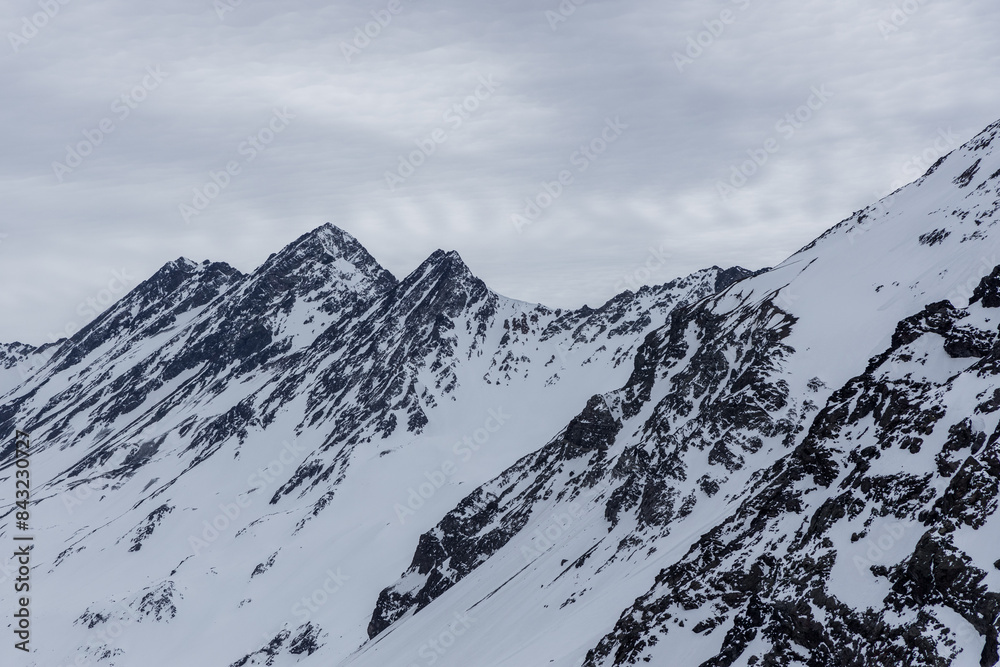 A freezing day high in the Andes Mountains in Chile, with mountains covered in snow.