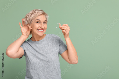 Mature woman with hearing a...