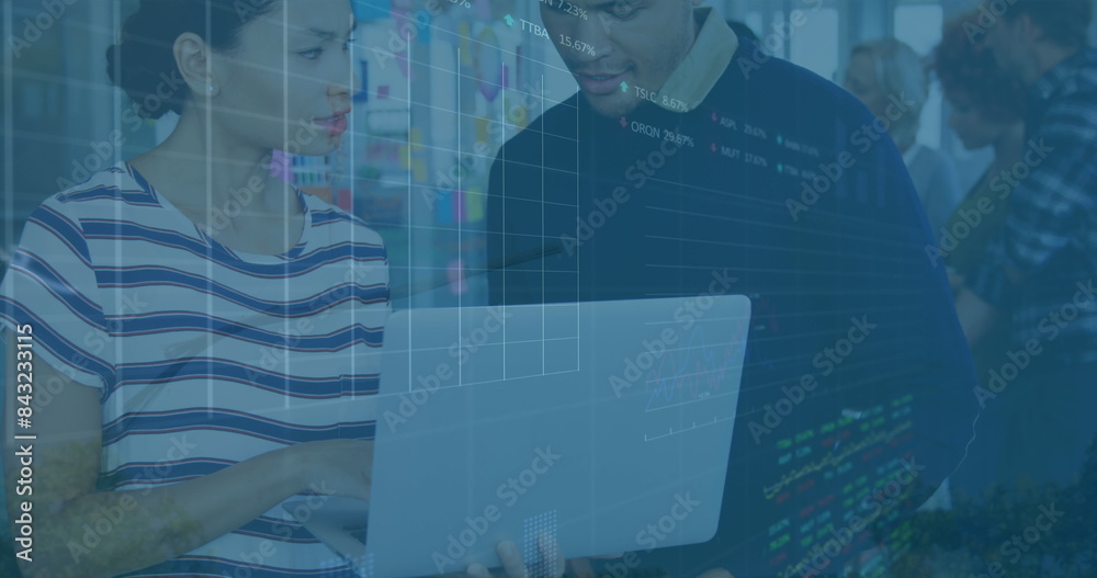 Image of financial data processing over diverse business people using computer in office Image of financial data processing over diverse business people using computer in office