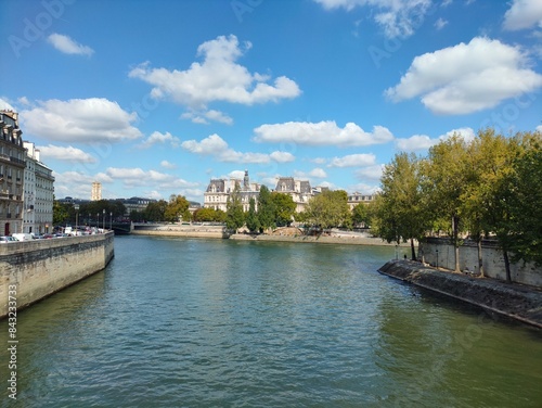 Bridge over the seine river against sky. Panoramic view from a bridge spanning the seine river, town hall in the horizon in paris