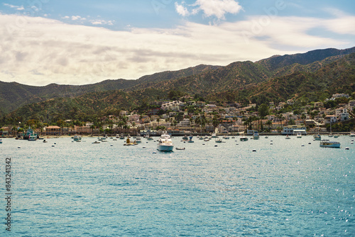 View of ocean, and boats at Avalon Harbor in Catalina Island, CA in summer from the ocean side. Sunny day