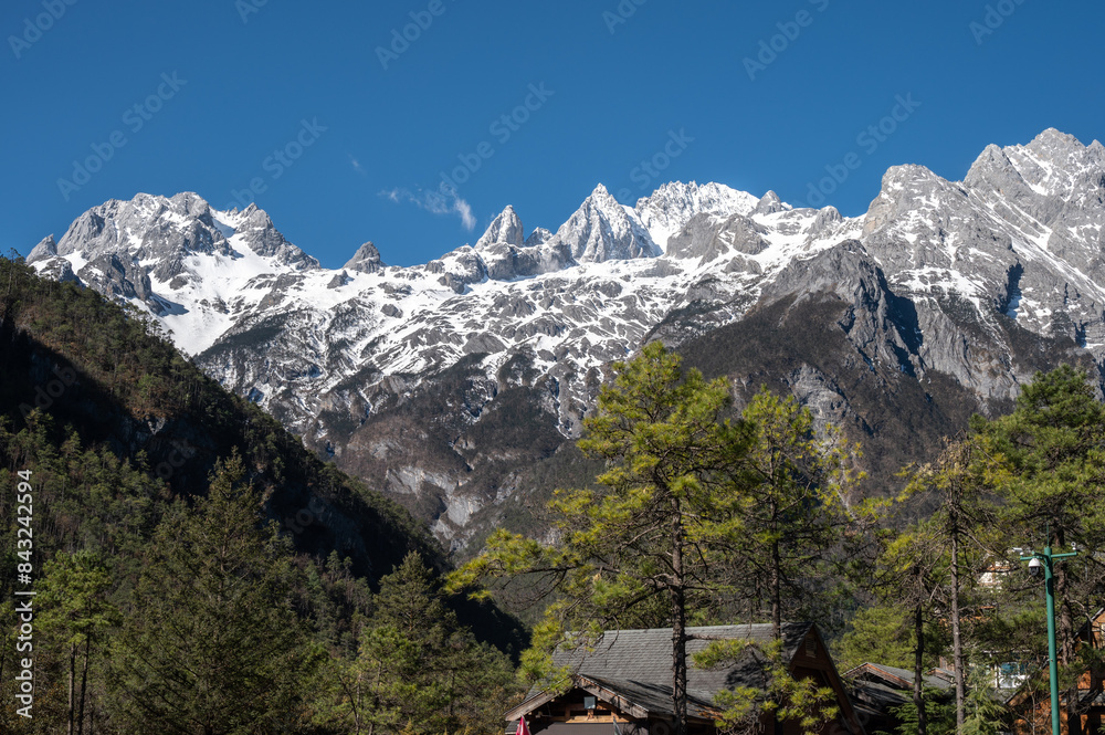 Beautiful view of Jade Dragon Snow Mountain (or MtYulong) in Yulong Naxi Autonomous County, Lijiang, in Yunnan province, China. Beautiful view of Jade Dragon Snow Mountain (or MtYulong) in Yulong Naxi Autonomous County, Lijiang, in Yunnan province, China.