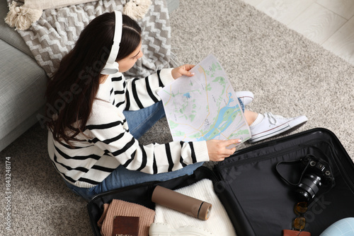 Young woman learning map ne...