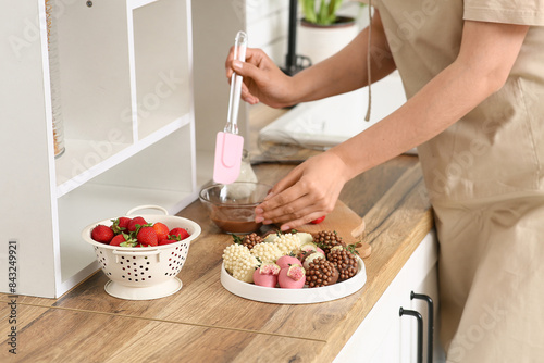 Woman preparing chocolate c...