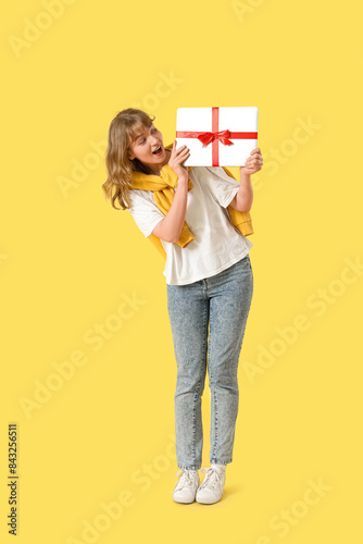 Young woman with gift lapto...