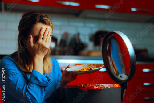 Sad Woman Disposing of Bad Food Scrapes. Unhappy person feeling upset for having to throw out food 
 photo