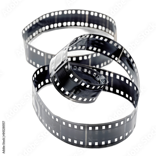 A black and white film strip is curled up and twisted