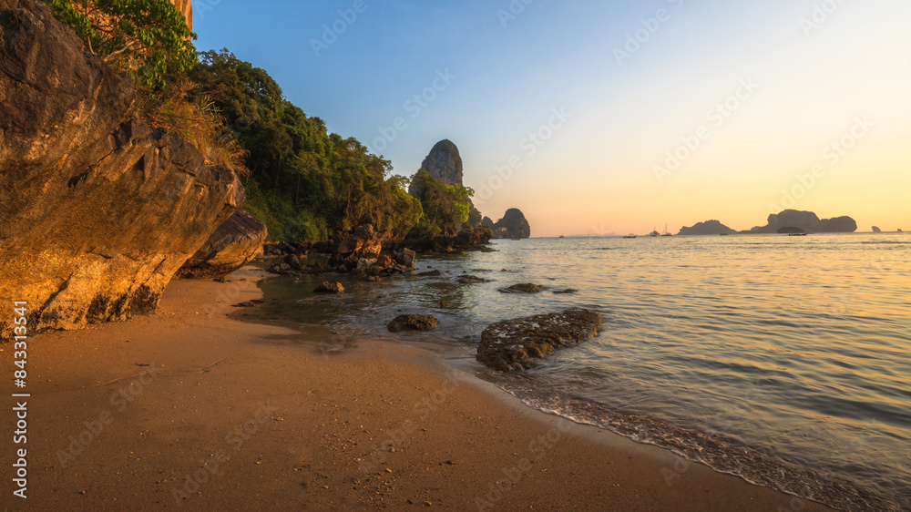 sunset at tonsai beach in railay in krabi in thailand