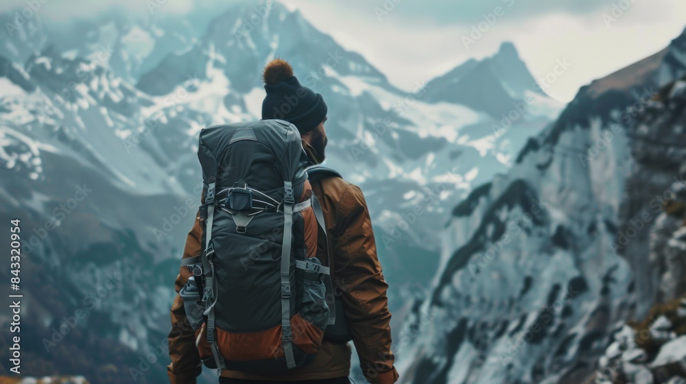 Adventurous man enjoying mountain hiking solo traveling outdoor active vacations traveler backpackin. Adventurous man enjoying mountain hiking solo traveling outdoor active vacations traveler backpackin.