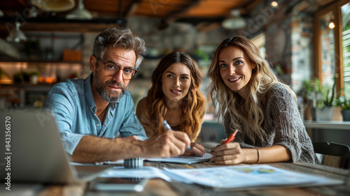 Mature couple discussing over documents with real estate agent at table.generative ai