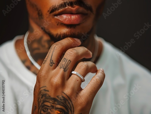 Close-up of a man's hand wearing a simple silver ring. photo