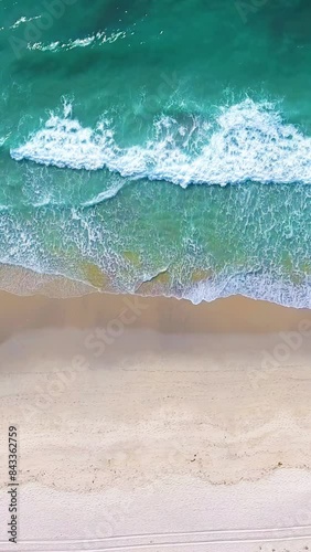 Aerial 4k: People on the beach on a hot summer afternoon