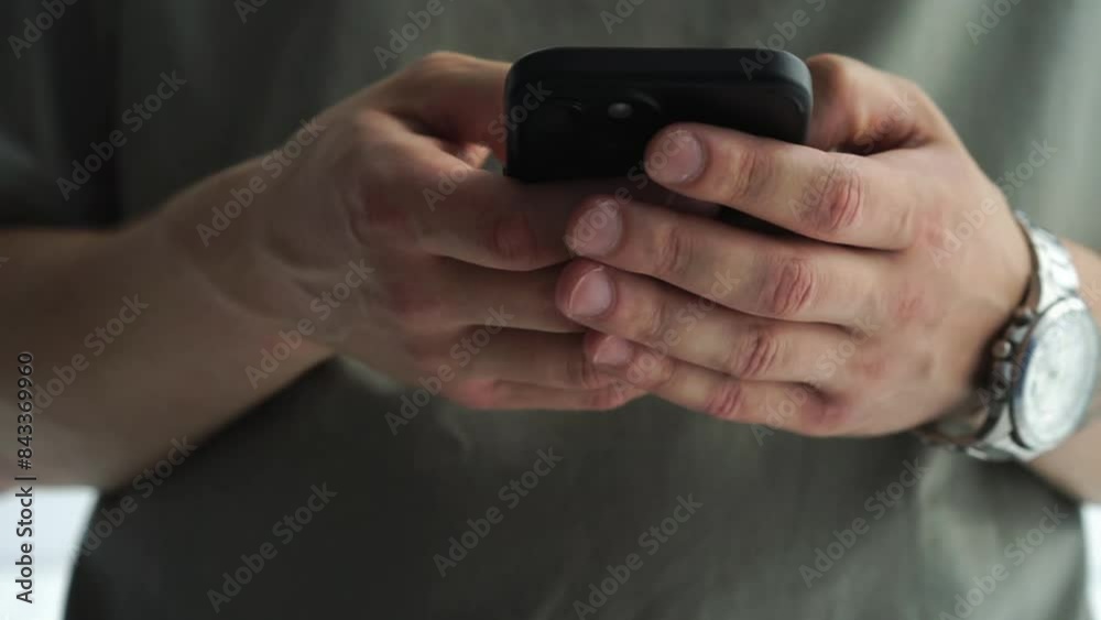 a guy in a green T-shirt is holding a phone in his hands.
The phone is in the hands of a man.
Smartphone screen clicks a guy in a green T-shirt is holding a phone in his hands.
The phone is in the hands of a man.
Smartphone screen clicks