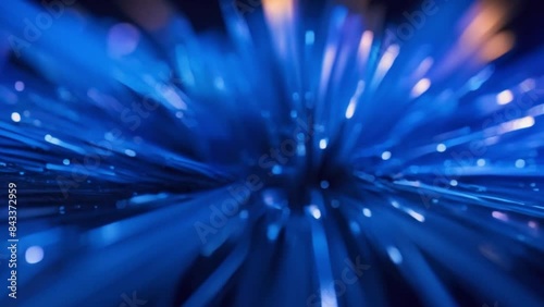 fibers of light that look like fiber optics, focusing on the central area where the light is most concentrated and radiating outwards in a burst pattern of footage photo