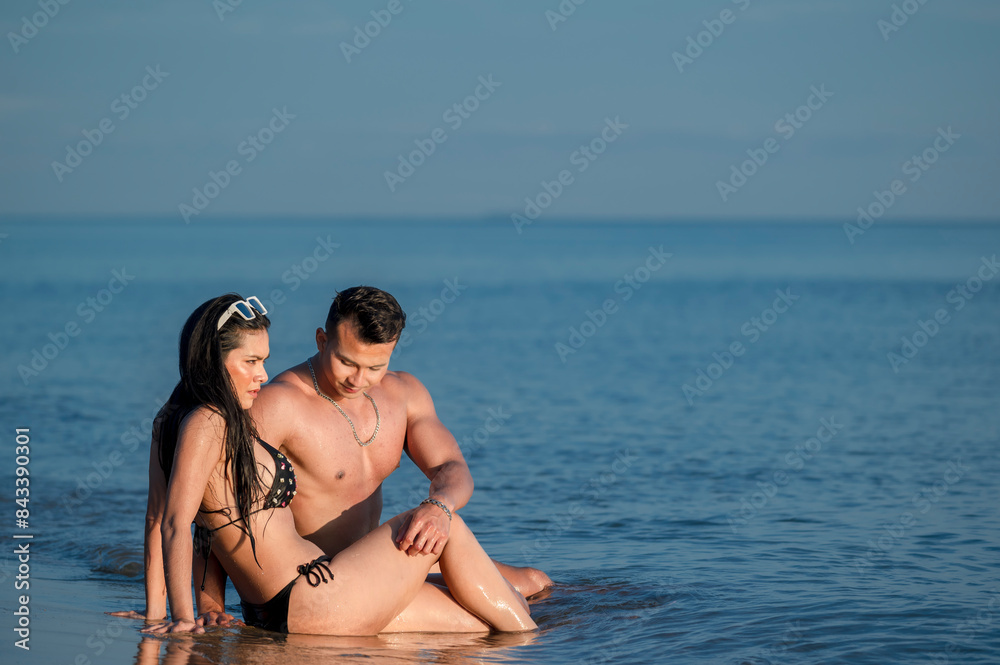 Happy romantic lover couple enjoy activity together at the beach with sunset gold lighting. - summer vacation on sea beach concept Happy romantic lover couple enjoy activity together at the beach with sunset gold lighting. - summer vacation on sea beach concept