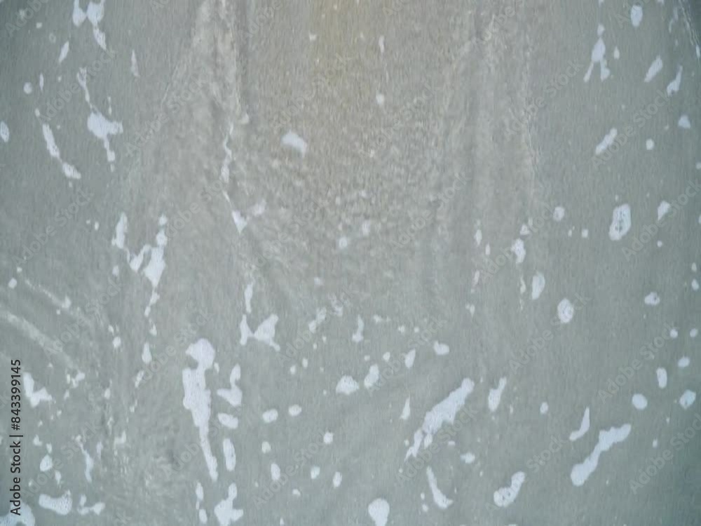 Emotional Release on Beach: 'Sadness' Washed Away by Sea Wave, Symbolizing Healing and Overcoming Grief, Distress, and Depression Emotional Release on Beach: 'Sadness' Washed Away by Sea Wave, Symbolizing Healing and Overcoming Grief, Distress, and Depression