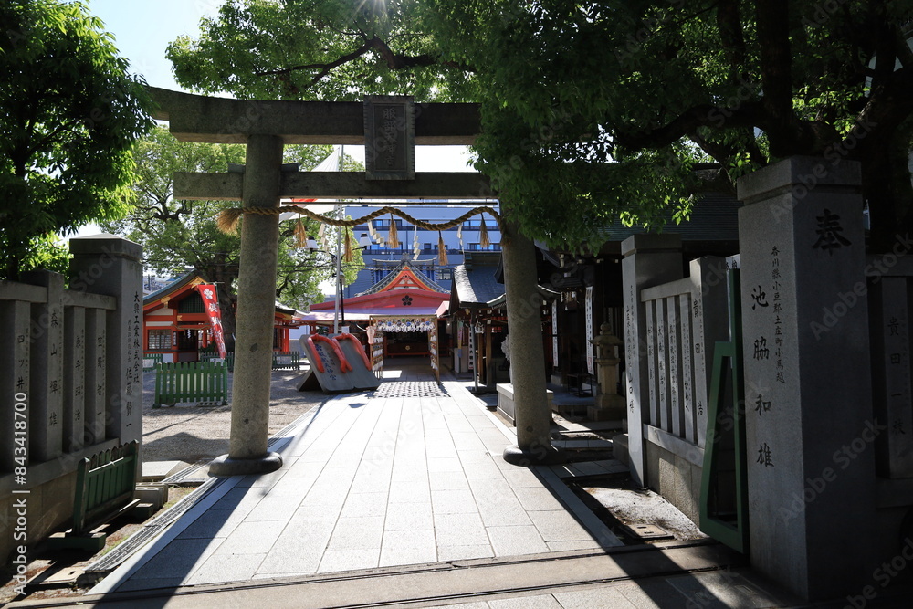 A Japanese shrine tin Toyonaka City in Osaka Prefecture : the scene of one of the entrance toriis to the precincts of Hattori-tenjin-gu Shrine A Japanese shrine tin Toyonaka City in Osaka Prefecture : the scene of one of the entrance toriis to the precincts of Hattori-tenjin-gu Shrine