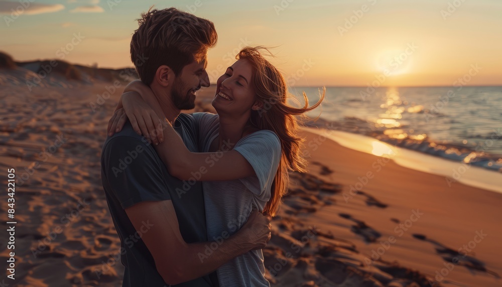 Fototapeta premium Sunset Serenity: A Couple Embraced in Love on the Sandy Shore