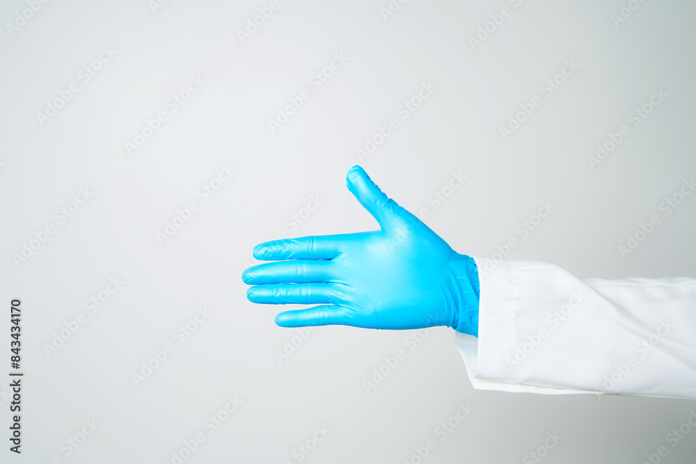 hand gestures or signs in blue disposable latex surgical gloves isolated hand gestures or signs in blue disposable latex surgical gloves isolated