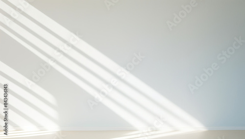 A photo of vertical striped shadows on a white wall, with soft shadow focus, in a minimalistic style, with a neutral color palette, featuring a clean and simple design at high resolution. 