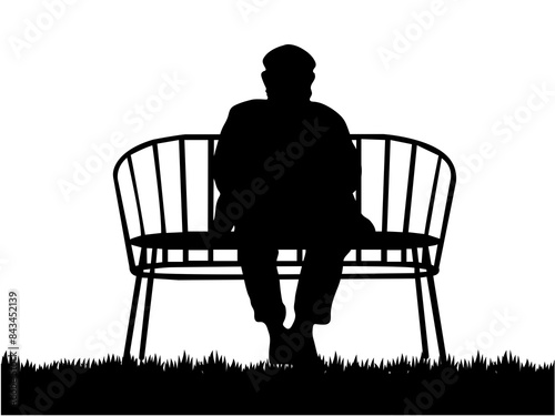An elderly man sitting on a bench. An old man sits on a bench chair silhouette.