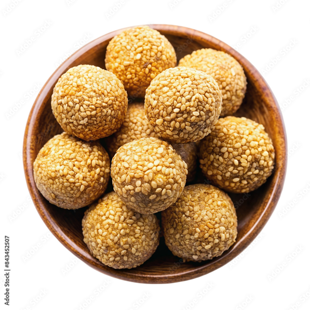 Indian sweet sesame laddu or til laddu in a bowl Isolated on transparent background Indian sweet sesame laddu or til laddu in a bowl Isolated on transparent background