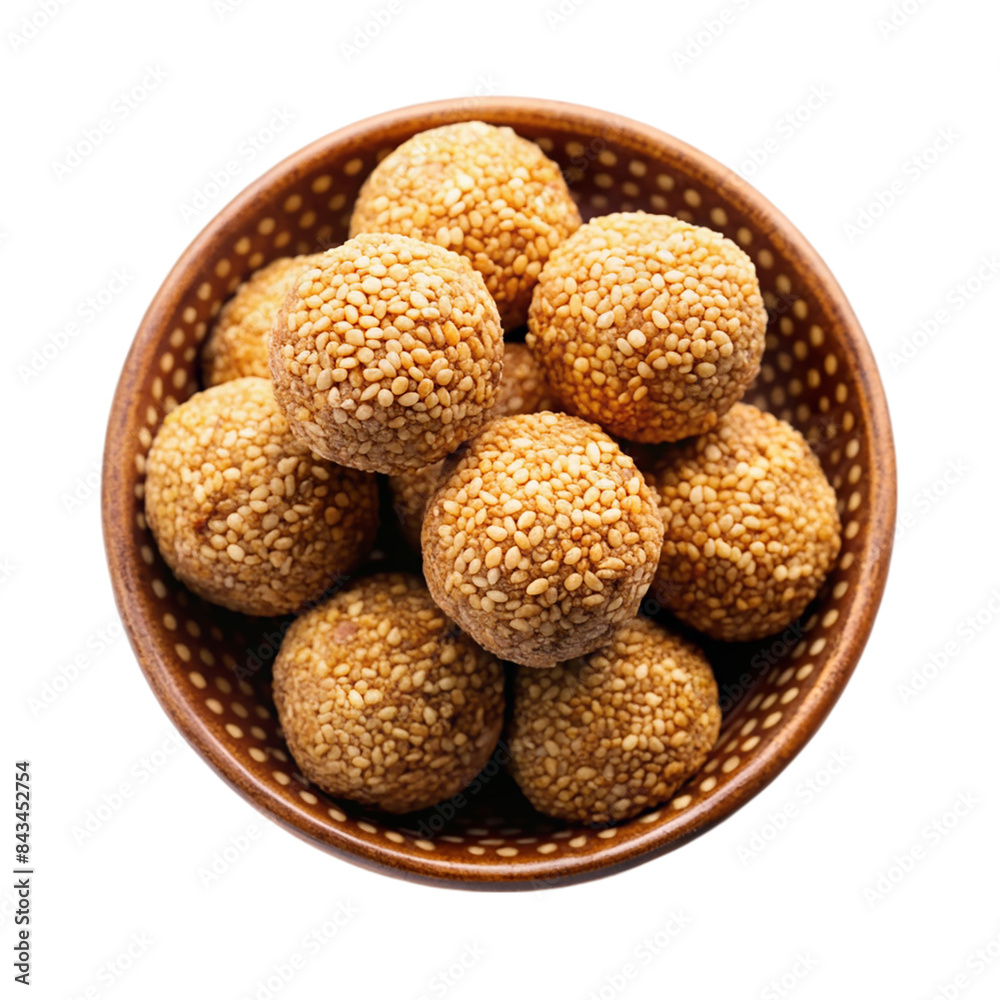 Indian sweet sesame laddu or til laddu in a bowl Isolated on transparent background Indian sweet sesame laddu or til laddu in a bowl Isolated on transparent background