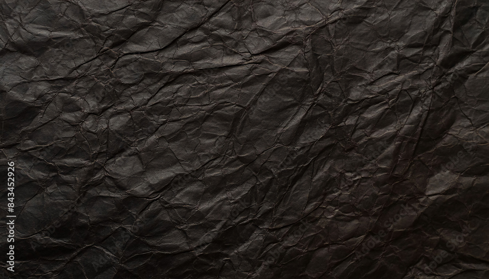 Handmade black paper with rough texture, creases, earthy tones, crumpled, wrinkled, art and craft projects Handmade black paper with rough texture, creases, earthy tones, crumpled, wrinkled, art and craft projects