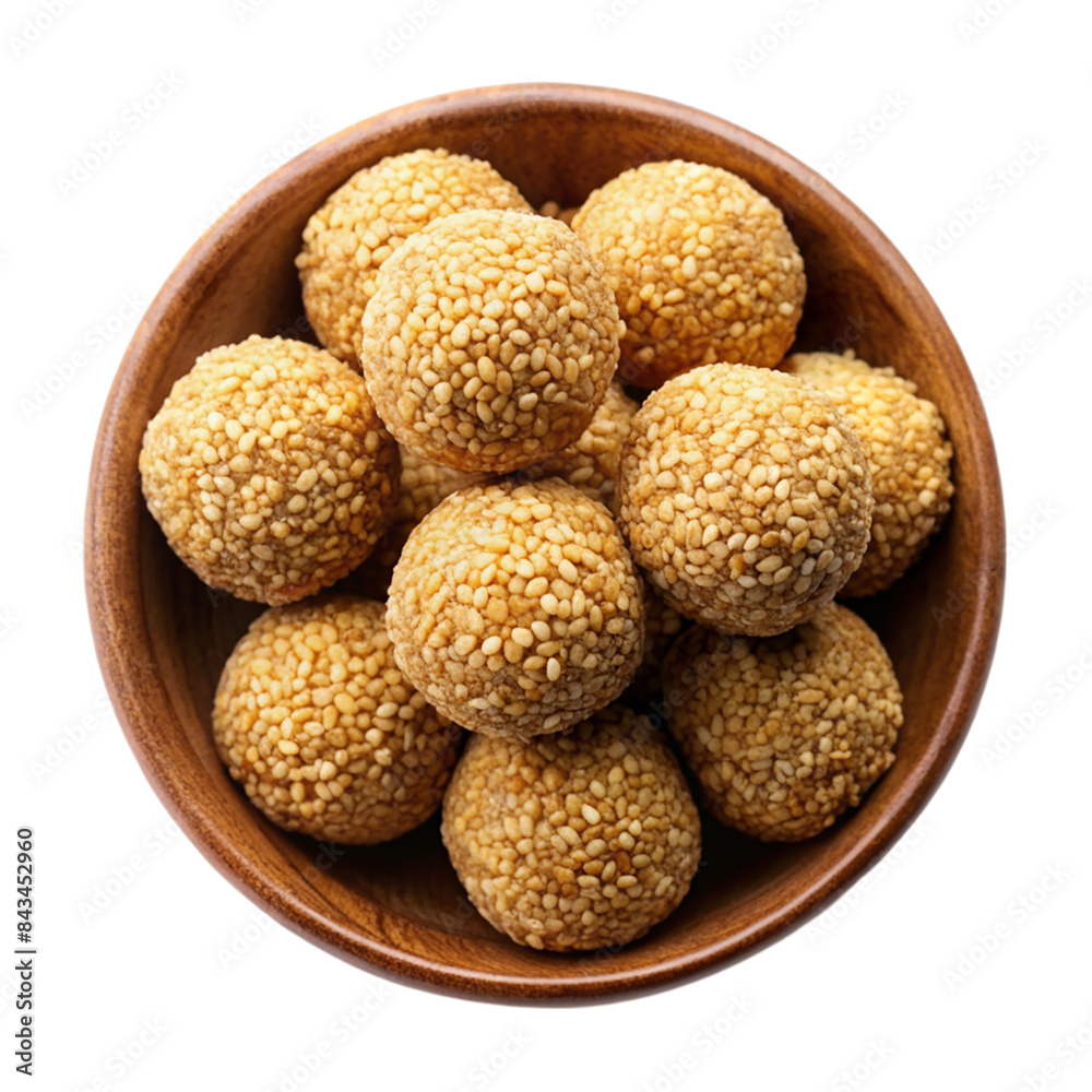 Indian sweet sesame laddu or til laddu in a bowl Isolated on transparent background Indian sweet sesame laddu or til laddu in a bowl Isolated on transparent background