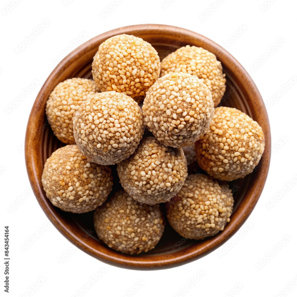 Indian sweet sesame laddu or til laddu in a bowl Isolated on transparent background Indian sweet sesame laddu or til laddu in a bowl Isolated on transparent background